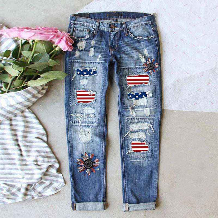 Distressed jeans with American flag patches on a light background