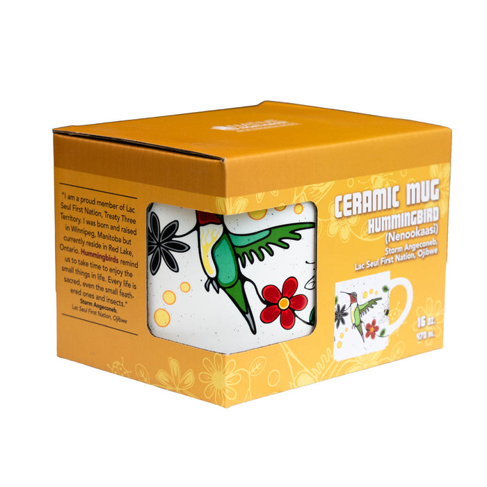 Ceramic mug with hummingbird design in a decorative box on a white background