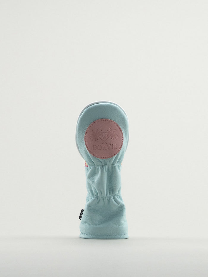 Revers of blue leather headcover showing pink Dormie badge