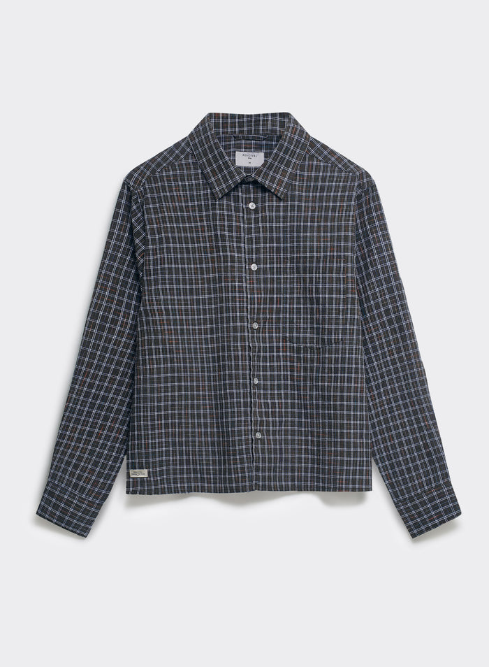 The Percival Hinsley brown checked boxy shirt, made from 100% cotton with a point collar and white buttons, shown flat.