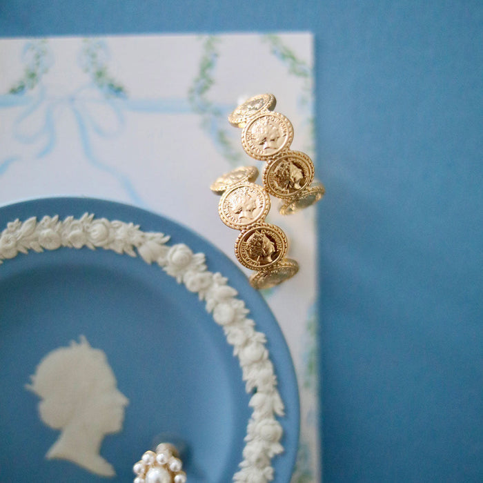 Model in the Queen Elizabeth Coin Hoop Earrings - Worn Gold