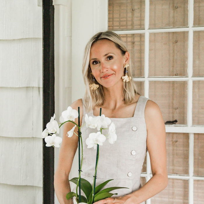 Model in the Susan Shaw Blue & White Ginkgo Earrings