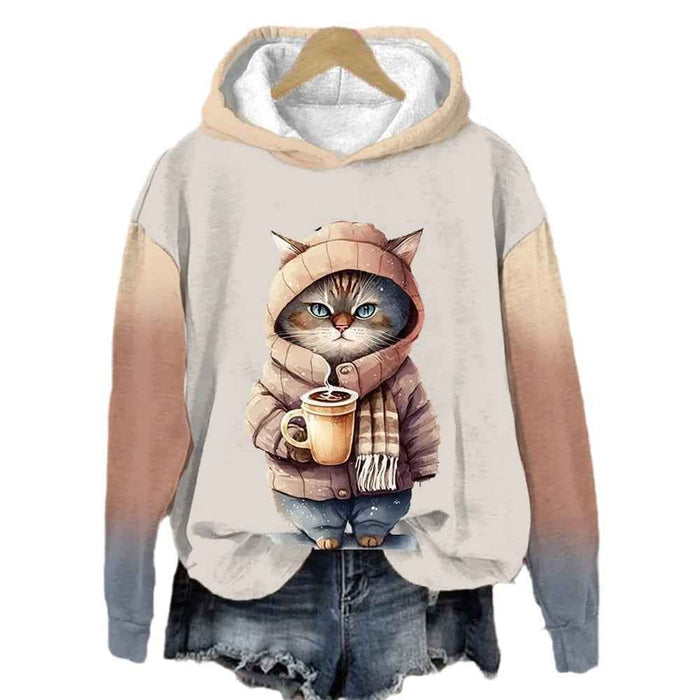 Hoodie with a cat design holding a coffee cup on a hanger