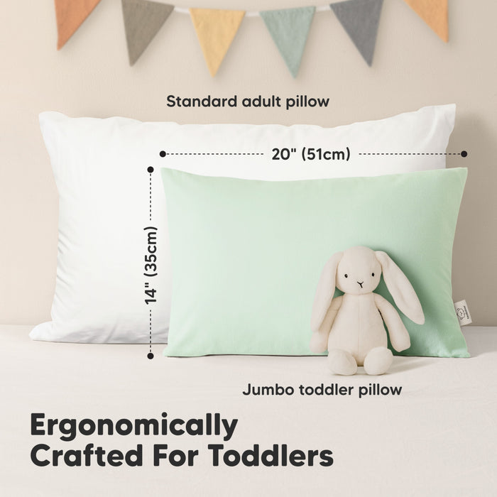 Ergonomically crafted for toddlers with jumbo toddler pillow size compared to standard adult pillow.