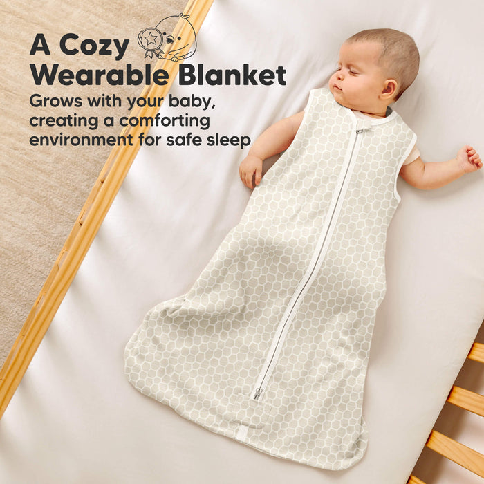 A cozy wearable blanket - grows with your baby, creating a comforting environment for safe sleep