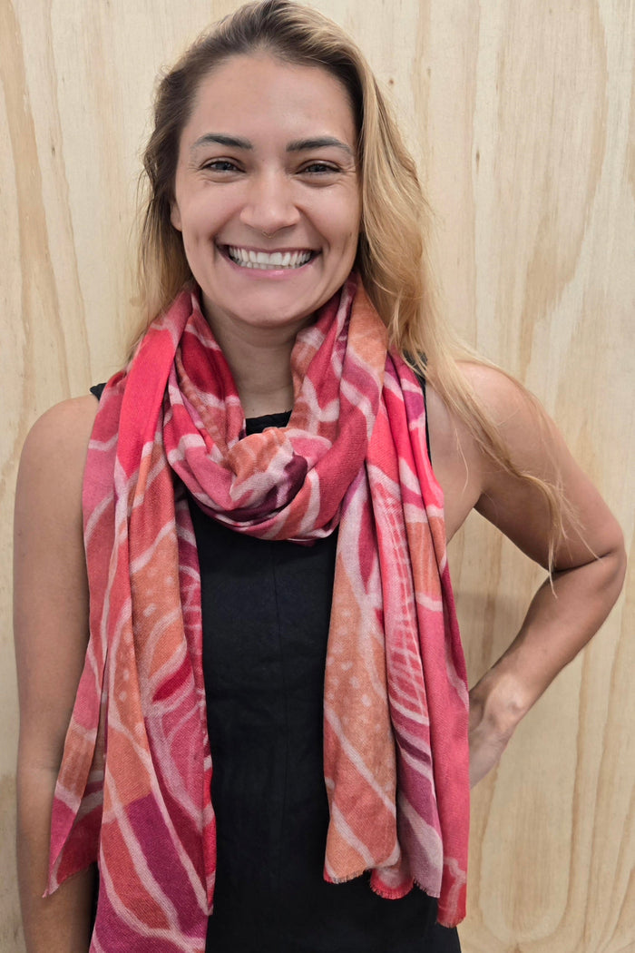 An Aboriginal woman wearing a Aboriginal artwork scarf in cashmere wool