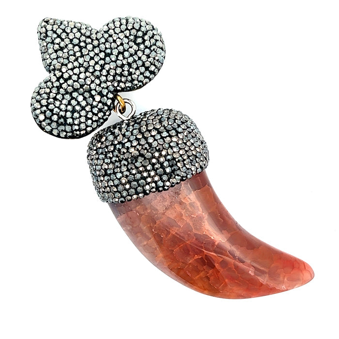 Amber horn-shaped pendant necklace with warm neutral tones and sparkling crystal embellishment.
