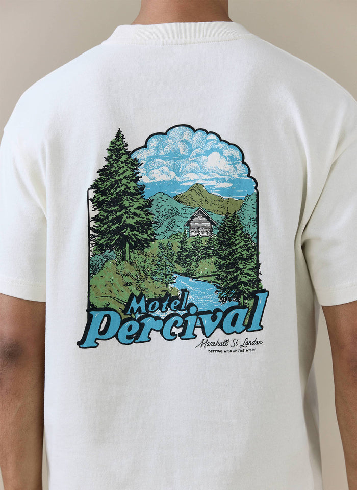 Back of the cream organic cotton Percival Arnold Oversized T Shirt with a mountain landscape and Motel logo graphic.