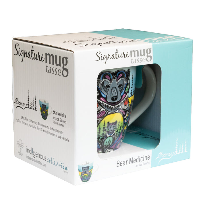 Colorful mug with bear design in a 'Signature mug' packaging box.