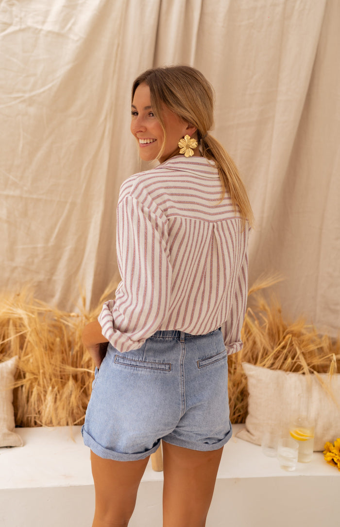 Model wearing beige and pink striped Bertha shirt