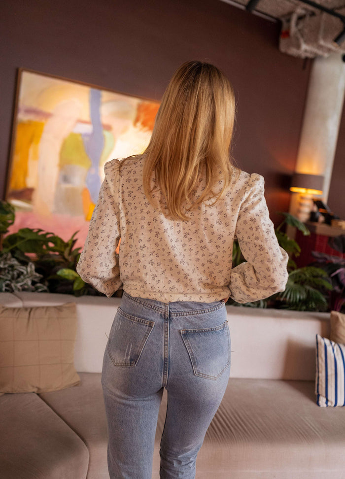 Model wearing beige floral Brida shirt