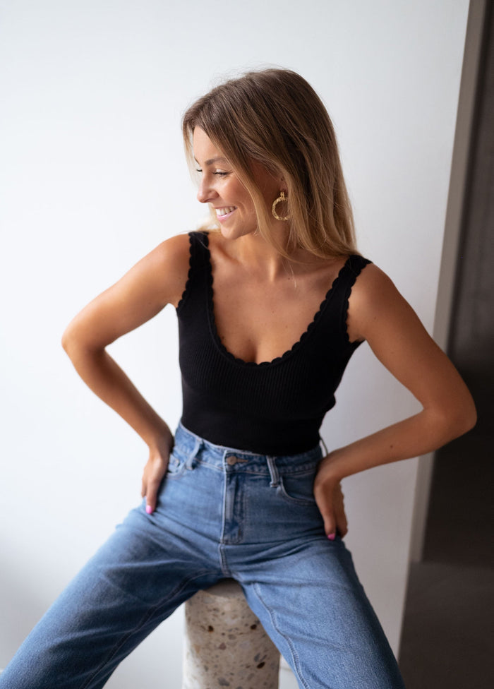 Front view of black ribbed knit tank