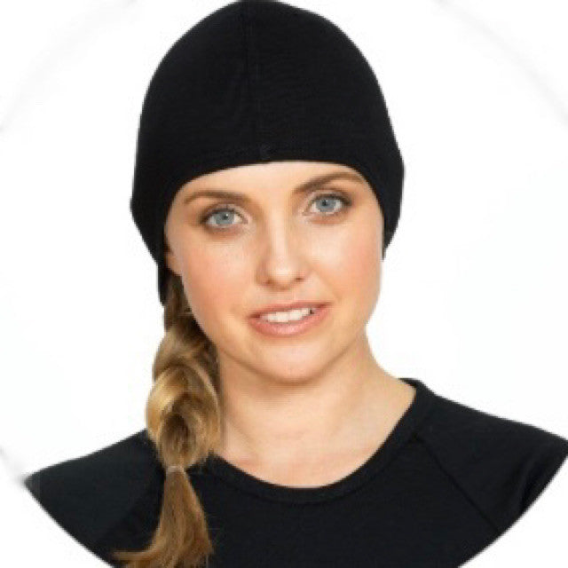 Woman wearing Merino wool black beanie.