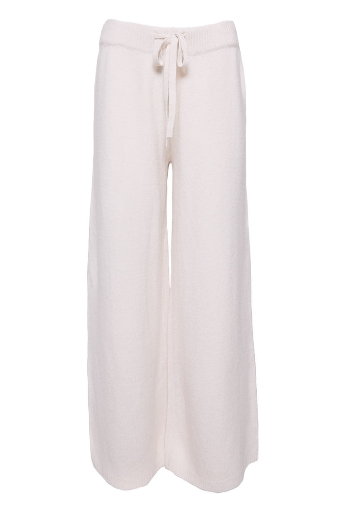 white pants in front of a white background