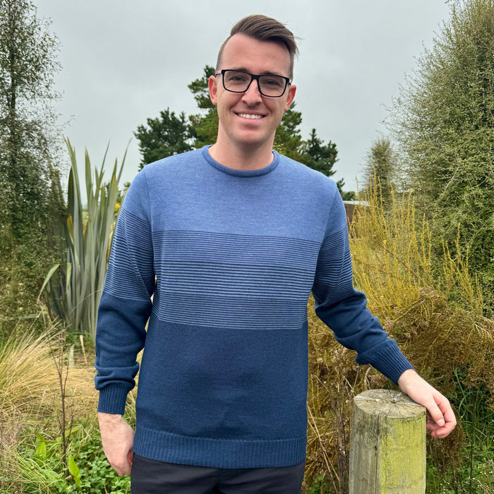 Man wearing the Country Laine - Mens Merino Midweight Graduated Stripe Crew in the colour Dark Indigo/Denim