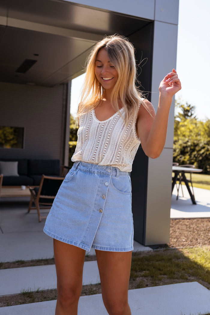 Denim skort styled with floral shirt, full outfit