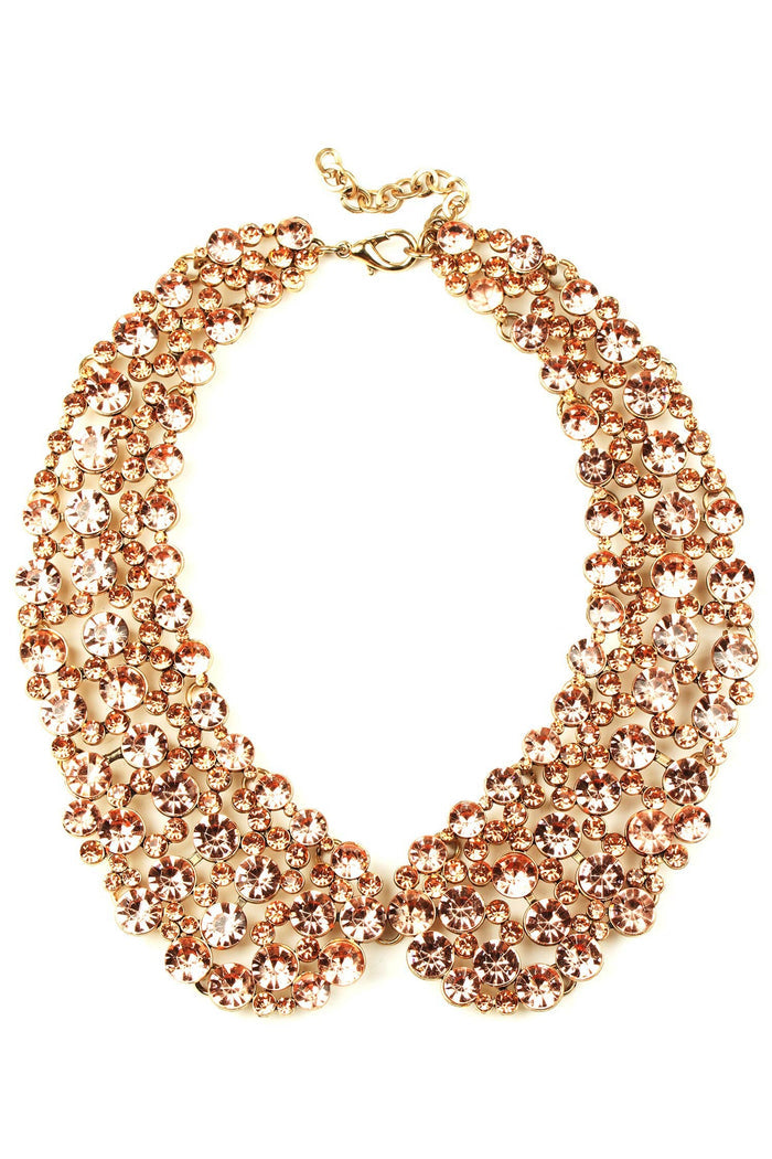 Diana Champagne Collar Necklace featuring champagne crystal embellishment, gold hardware, and a sculpted statement collar design.