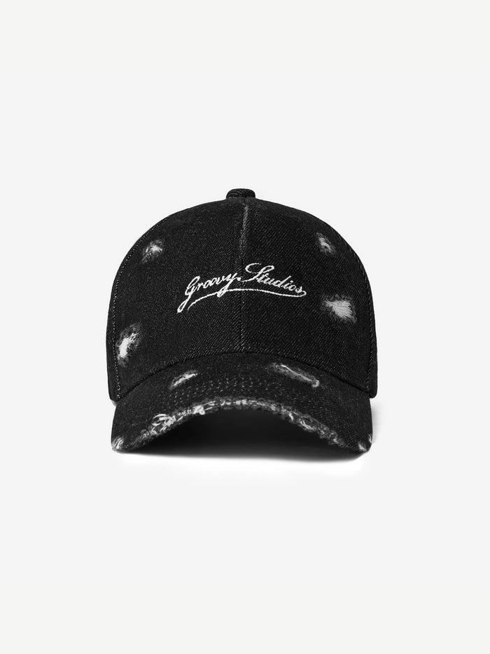 GROOVY Distressed Denim cap in washed black with frayed, distressed detail