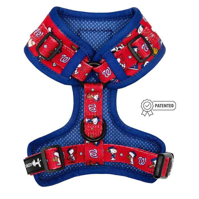 The Sassy Woof Dog Adjustable Harness - MLB™ x Peanuts™ Washington Nationals™ features red and blue mesh, adjustable straps, playful Snoopy graphics, W logos, and a PATENTED badge beside the harness.