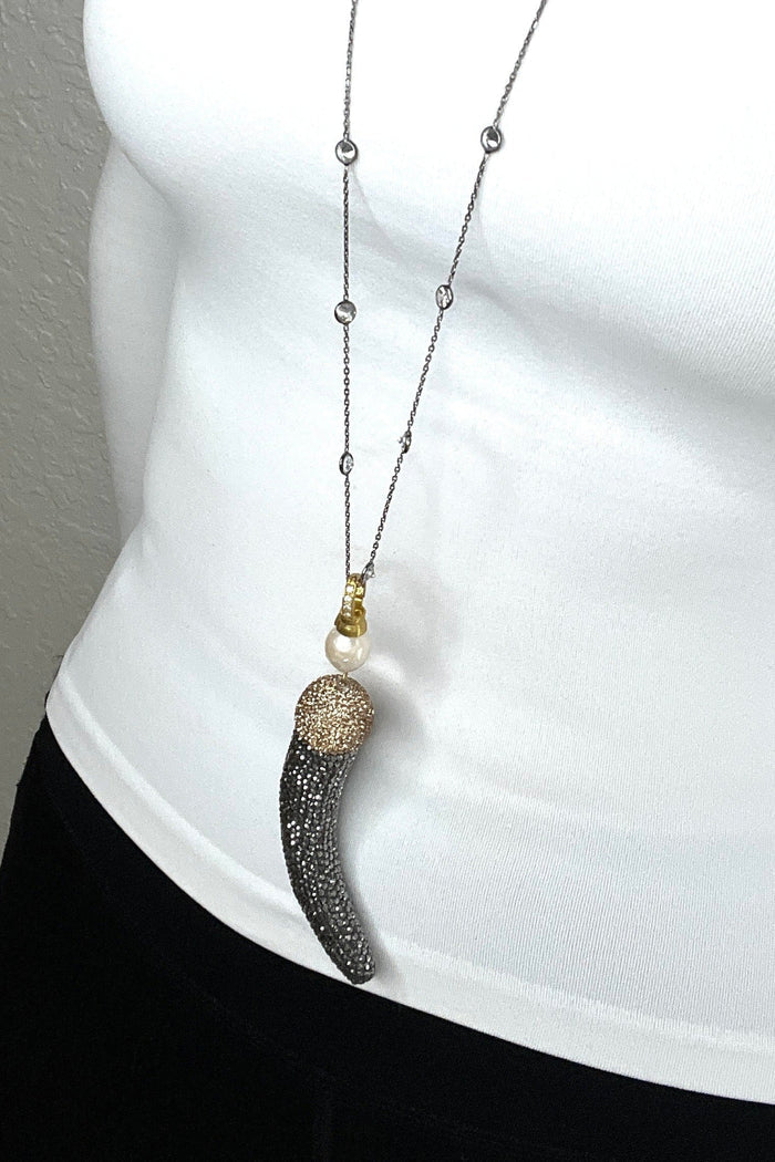Style the Dual Tone Crystal Horn Pendant Long Necklace exclusively at Born To Glam