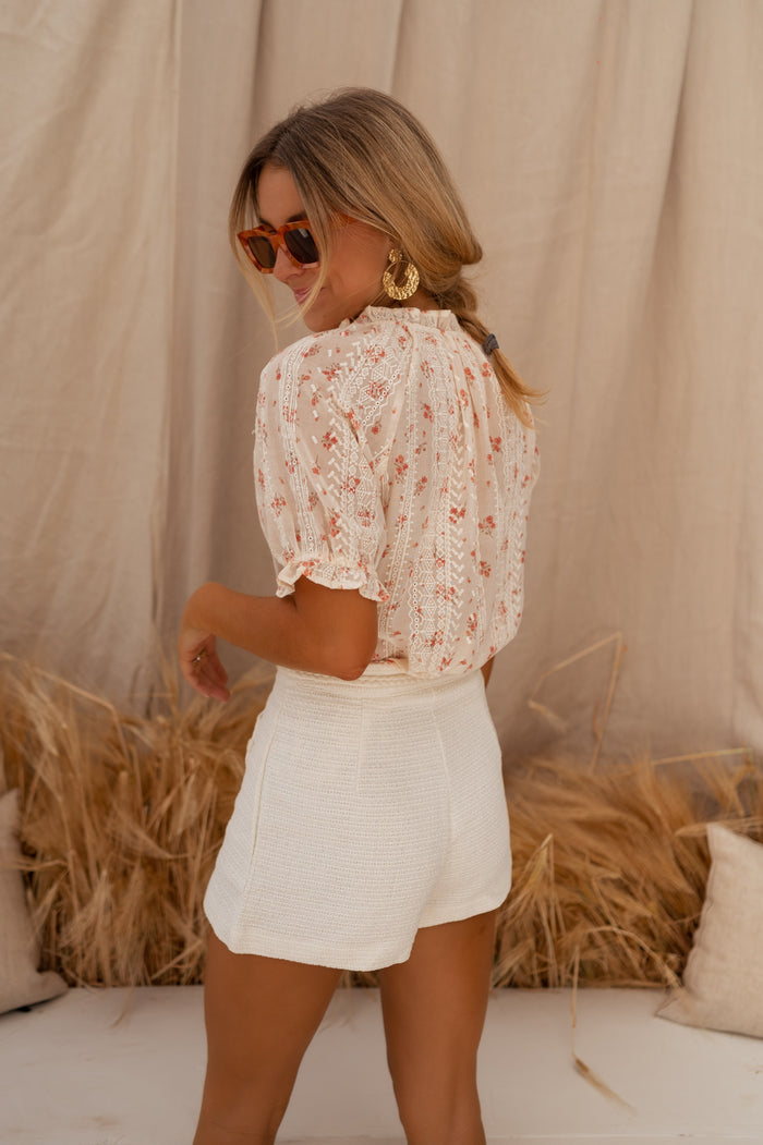 Ecru Adrian shorts styled with blouse