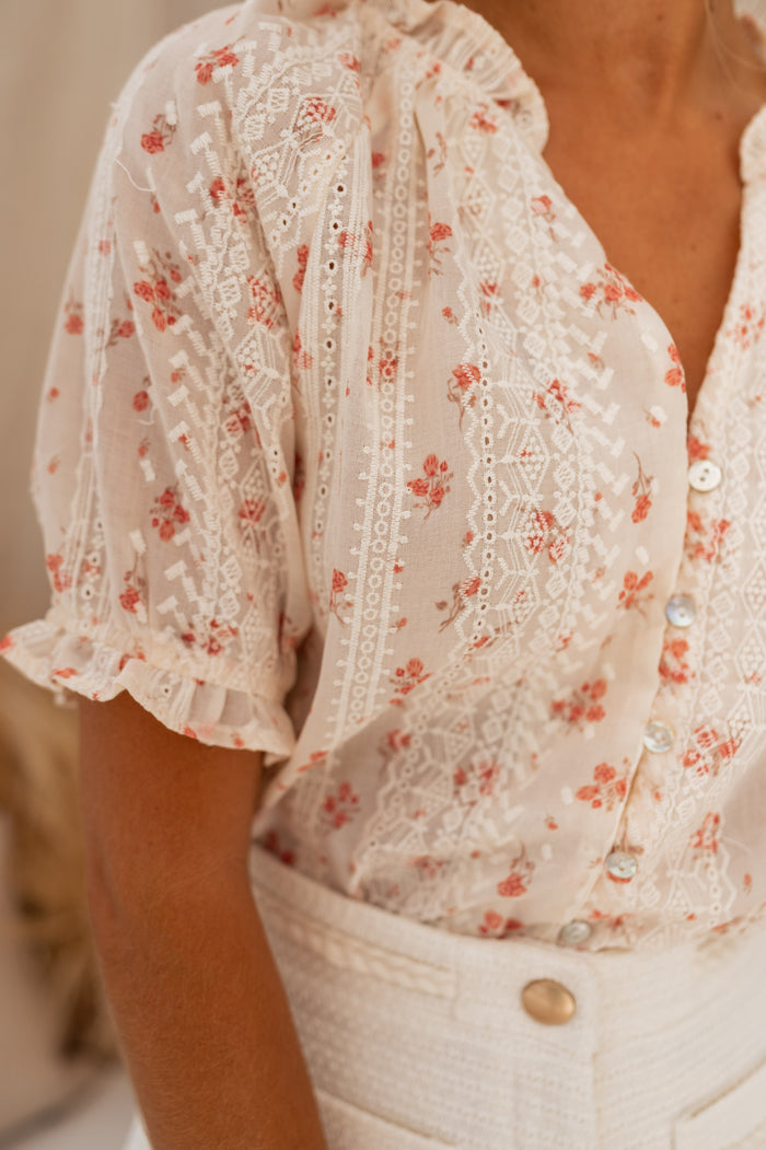 Ecru Carine blouse showing floral embroidery and openwork detail