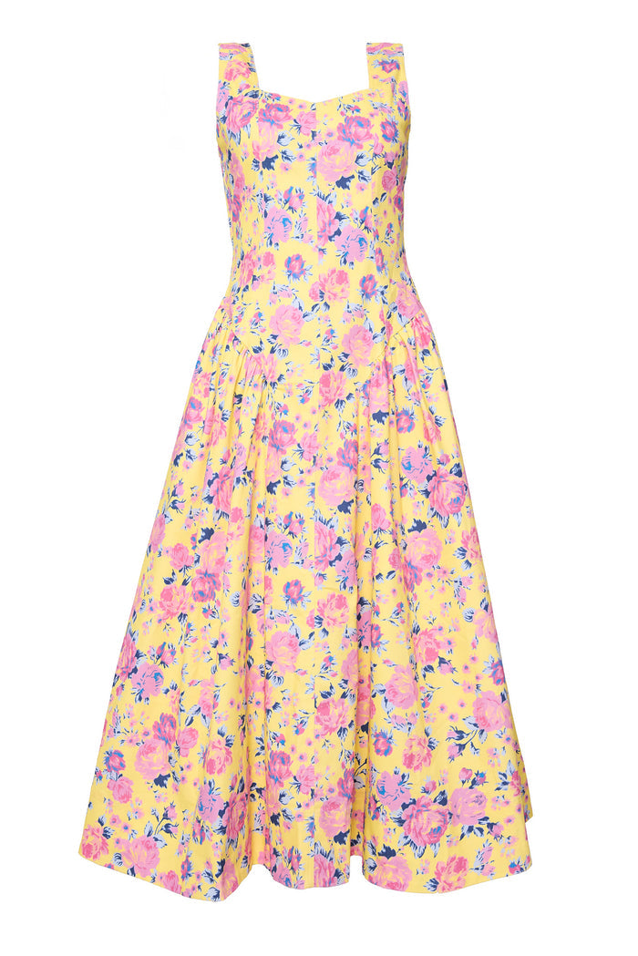 yellow floral dress against white background