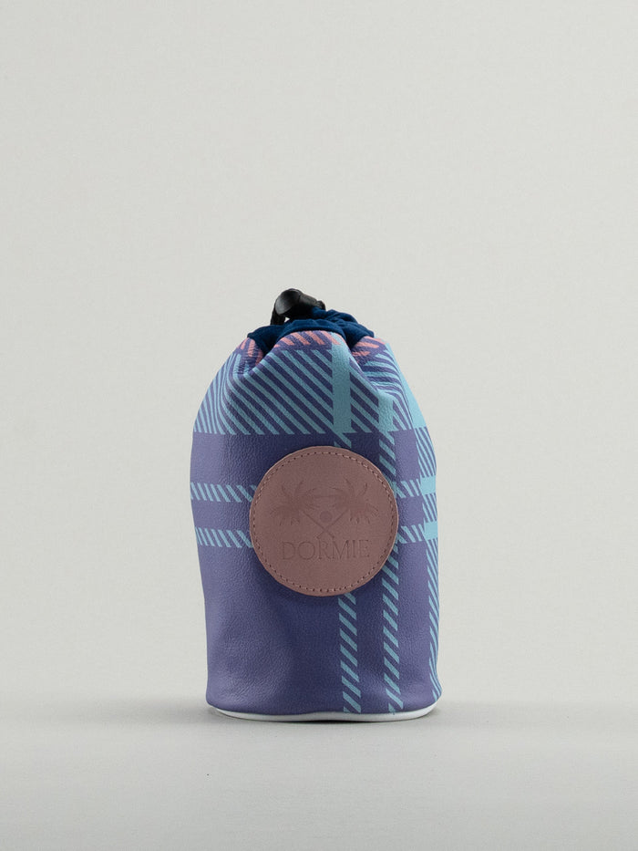 Blue and pink tartan bag showing leather badge with dormie embossed on it.