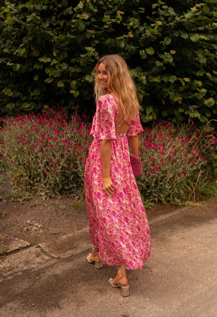 Pink floral Daphne maxi dress with open back, back view