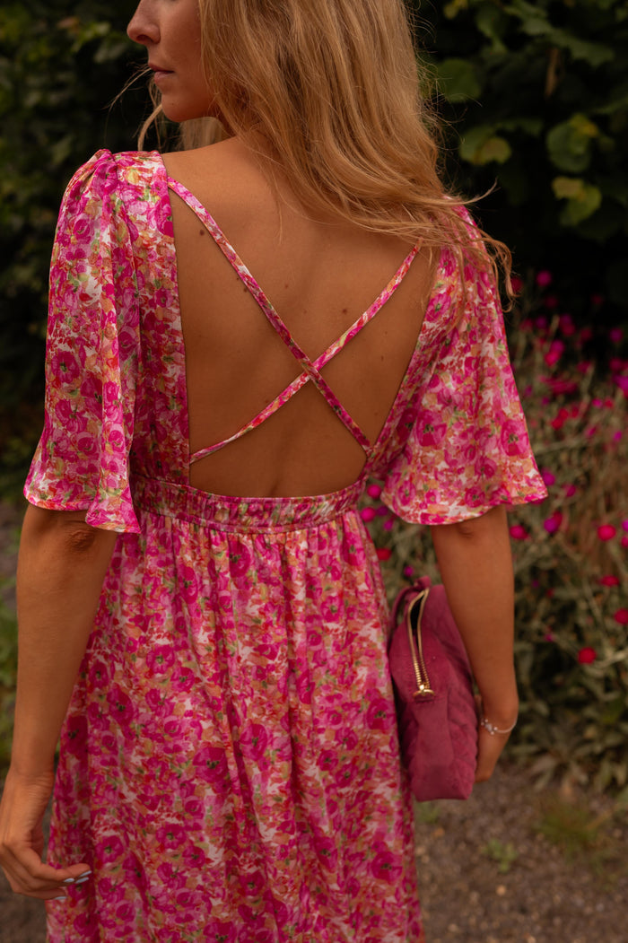 Pink floral maxi dress flowing skirt, side view