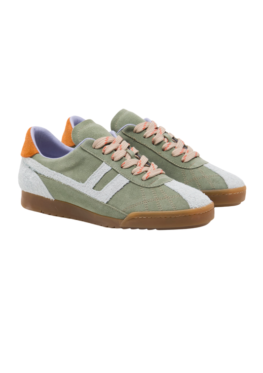 Green sneakers with white soles and orange accents on a white background