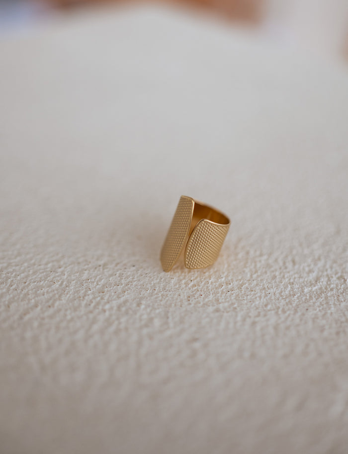 Golden Alouma textured gold ring detail
