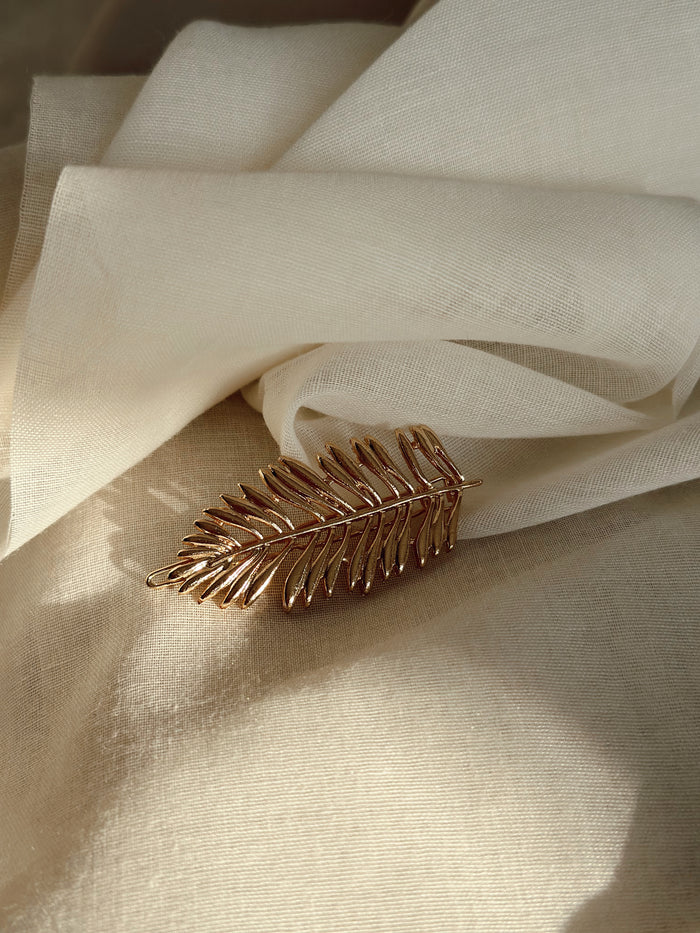 Golden Cannes feather barrette detail