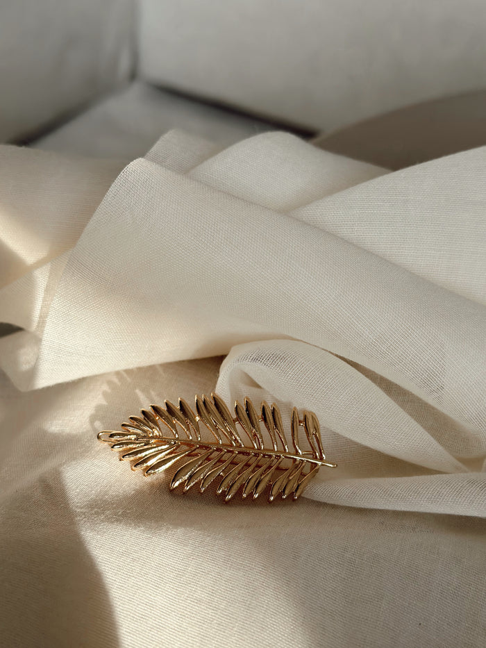 Golden Cannes gold feather hairclip styled