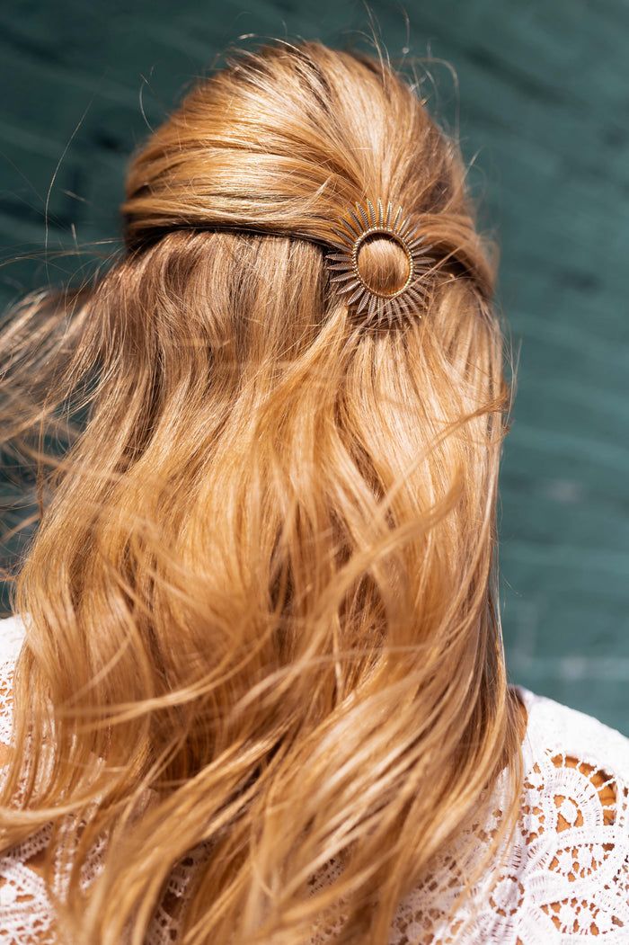 Golden Sola hairclip styled in hair