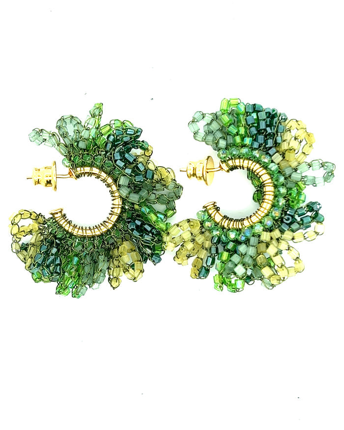 Green and gold crystal hoop earrings with beaded embellishment and a vibrant statement jewelry finish.