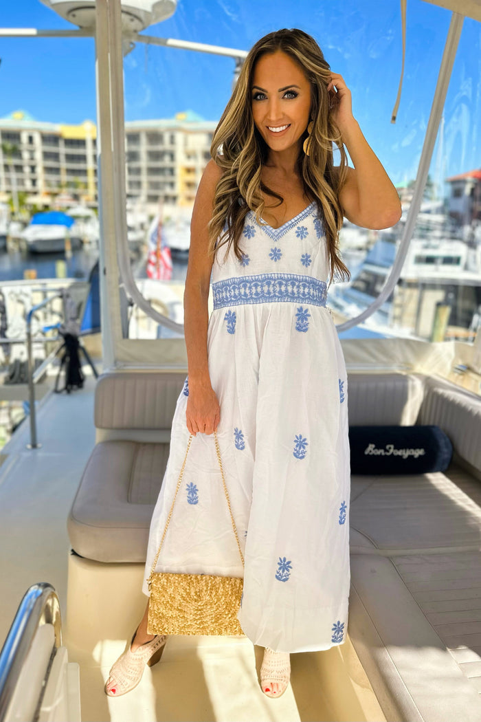 Model on boat wearing Gretchen Scott Fiesta Time maxi  Dress in White/Periwinkle