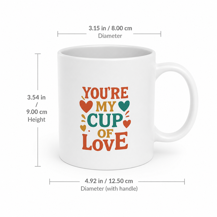 White ceramic heart-shaped mug with a colorful design, curved heart handle and polished surface for a romantic coffee moment.