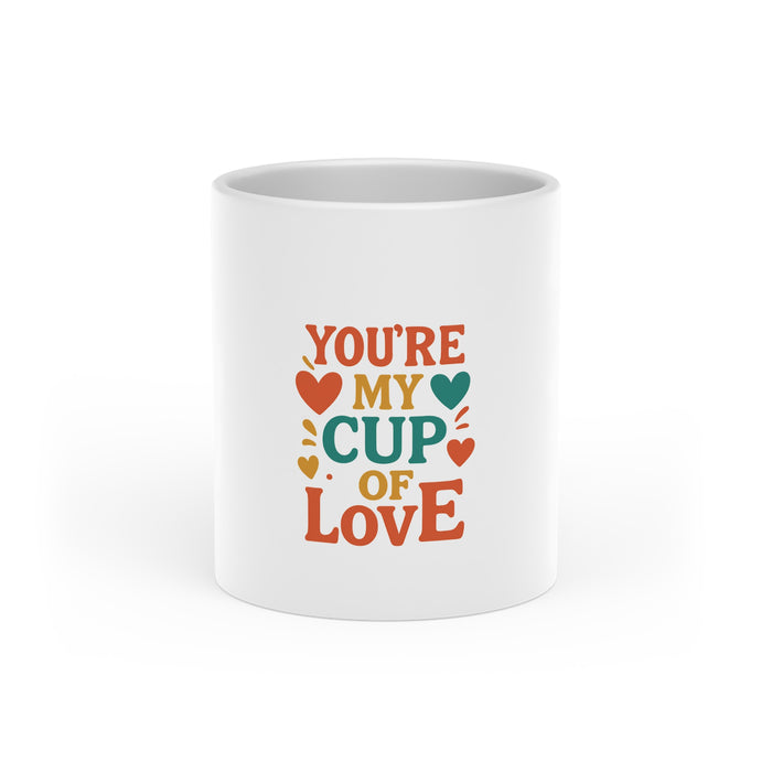 Heart handle mug shown in white ceramic with bright printed design and glossy coating, suitable for coffee, tea or daily use.