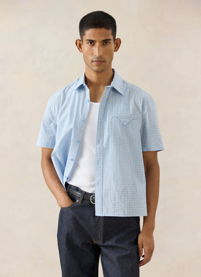 Blue check Percival Hinsley Boxy Short Sleeve Shirt in cotton, styled with dark Percival Heritage denim jeans.
