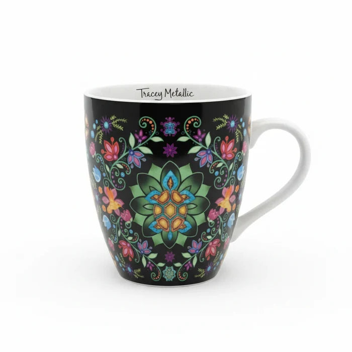Mug with colorful floral and butterfly design on a black background
