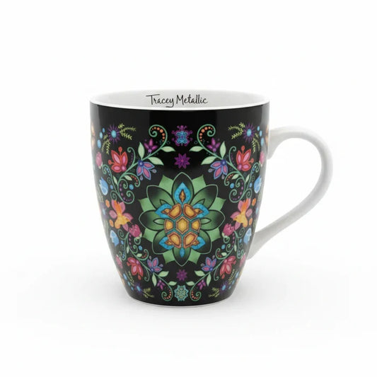 Mug with colorful floral and butterfly design on a black background