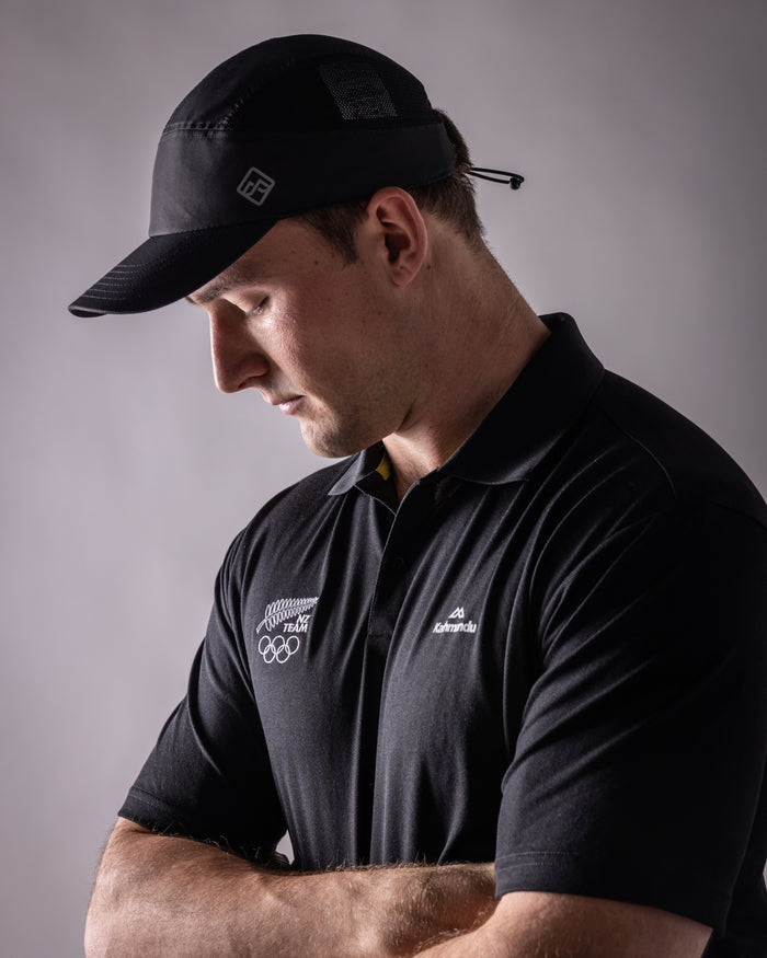 B2320_OZ7_NZOC_Range_Mns_Vanua_Polo_v3_NZ_Team_Black_b_1756683779000