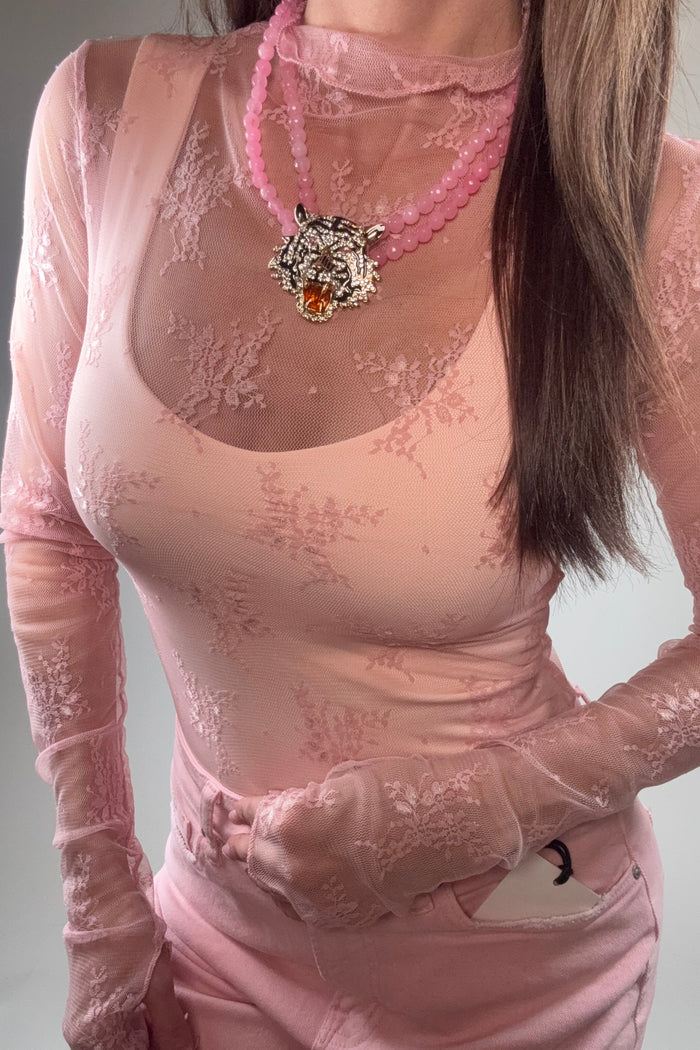 Soft pink sheer mesh lace long sleeve fitted top with a high neckline and floral lace pattern.