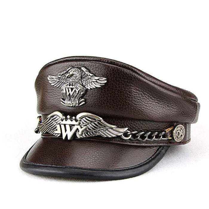 Brown leather cap with metal emblem and chain on a white background