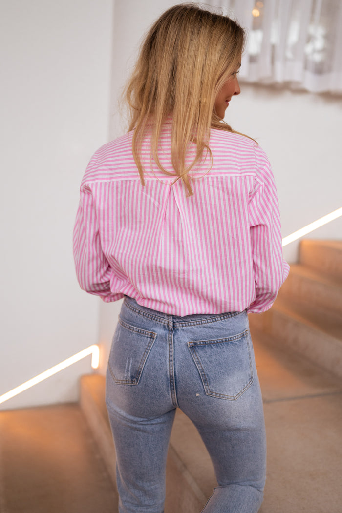 Model wearing pink striped Raphi shirt
