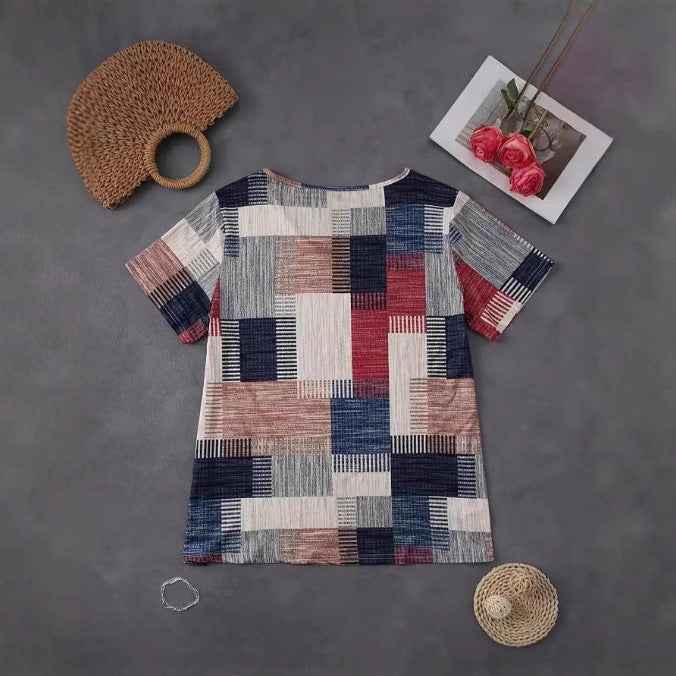 Women's plus size T shirt with zipper accent and geometric print presented for online comparison for a clear view of the top.