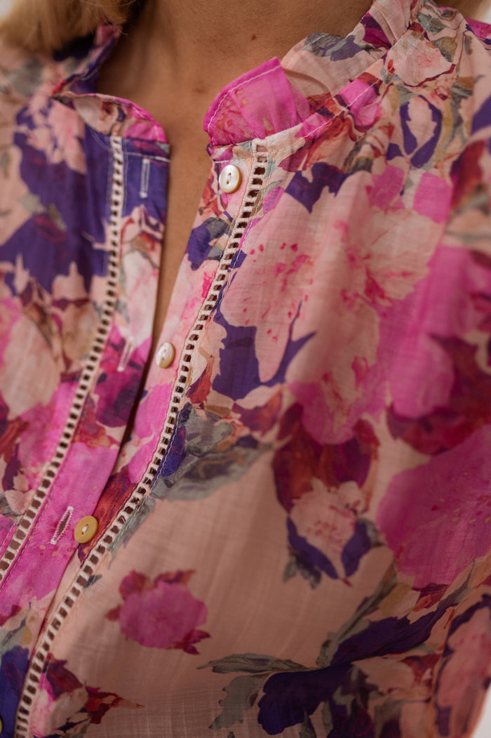 Model wearing purple floral Rory shirt