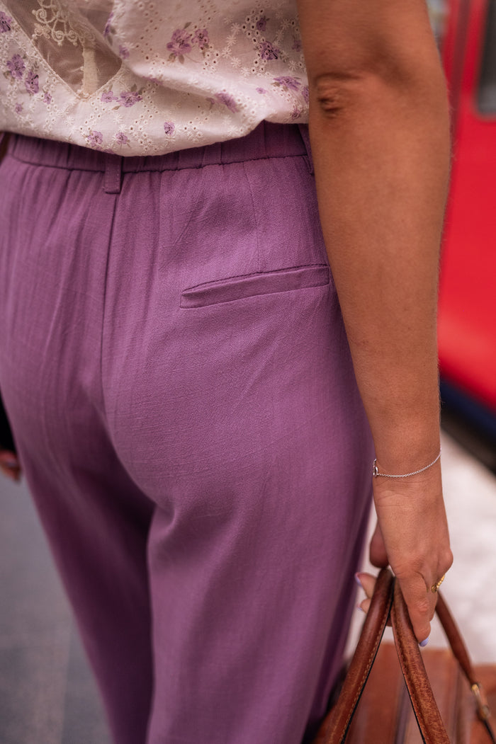 Model wearing purple linen Joey wide-leg pants