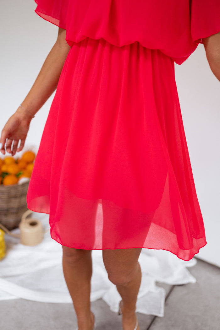 Model wearing raspberry Amandine mini dress